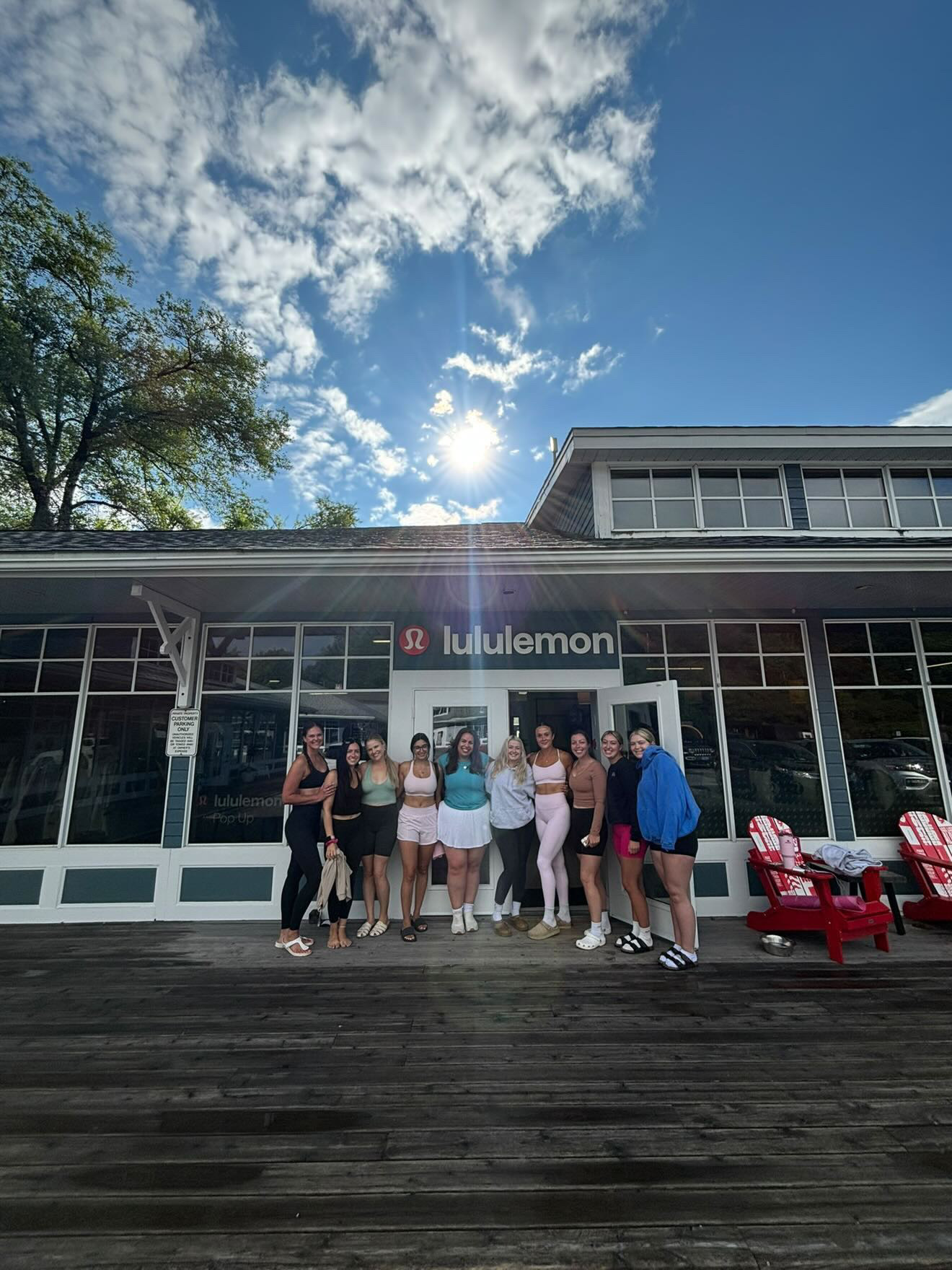 Maddie and a group of clients outside a Lululemon pop-up store where she taught a community Pilates class
